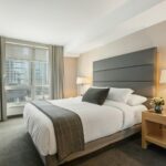 white bed linen on bed